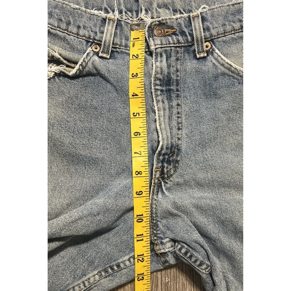 Vintage Levi's 550 Heavily Distressed Light Wash Blue Jean Shorts Size 32x10 USA